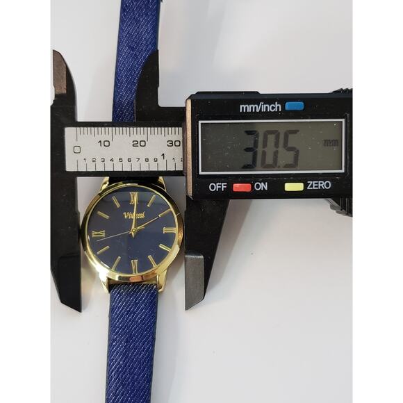 Vivani WAC5341KL 0520. Blue face with gold accents, denim blue band.